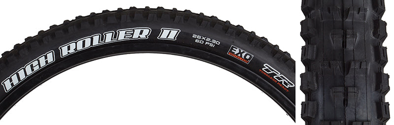 Close-up of the 26x2.3 High Roller II DC/EXO/TR Bicycle Tire, highlighting the tread pattern and white text on the black tire, designed for improved braking and traction on hard surfaces.