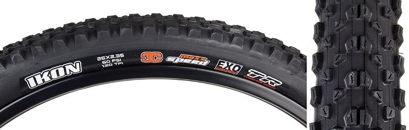 Close-up of a 26x2.35 Ikon EXO/TR Bicycle Tire, showcasing its high-volume casing, fast-rolling tread design, and visible white branding text on the black rubber surface.