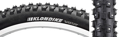 26x2.35 Klondike Wide Sport Bicycle Tire, close-up of tread with tungsten carbide tipped studs for traction, ideal for icy conditions with a large casing for better snow flotation.