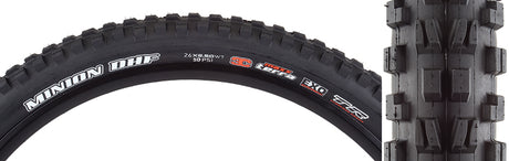 Close-up of the 26x2.5 Minion DHF TERRA/EXO/TR/WT Bicycle Tire, showcasing its black rubber, white text, and intricate tread pattern designed for enhanced control and puncture protection.