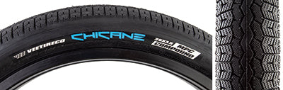 Close-up of the 26x3.5 Black/Black Chicane Bicycle Tire by Vee Tire and SE Bikes, showcasing its rounded block tread with shallow siping for enhanced grip.