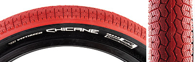 Close-up of the 26x3.5 Red/Black Chicane Bicycle Tire, featuring a BMX-style rounded profile block tread with shallow siping, designed by Vee Tire in collaboration with SE Bikes for vintage styling.