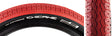 Close-up of the 26x3.5 Red/Black Chicane Bicycle Tire, featuring a BMX-style rounded profile block tread with shallow siping, designed by Vee Tire in collaboration with SE Bikes for vintage styling.