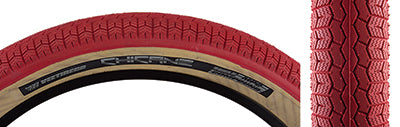 Close-up of the 26x3.5 Red/Tan Chicane Bicycle Tire, featuring a BMX-style rounded profile block tread with shallow siping for improved grip, highlighting its vintage-inspired design by Vee Tire and SE Bikes.