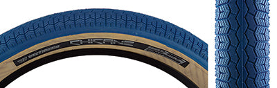 Close-up of the 26x3.5 Blue Chicane Bicycle Tire by Vee Tire and SE Bikes, showcasing its BMX-style rounded profile block tread with shallow siping for improved traction.