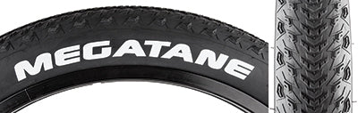 Close-up of a 26x4.0 Megatane Bicycle Tire featuring tightly spaced, low profile center knobs and open shoulder knobs, designed for optimal performance on sand and fresh snow.