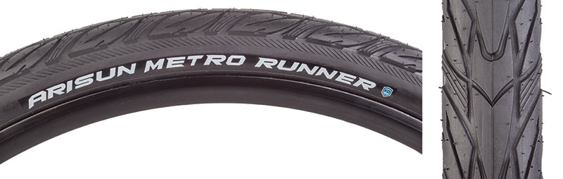 Close-up of a 27.5x1.75 Metro Runner Wire/60 Bicycle Tire, showcasing its versatile tread with directional deep siping and textured shoulders, designed for hardpack and pavement use.