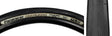 Close-up of the 27.5x1.90 Black/Black Gravel King Slick Bicycle Tire, highlighting its minimal file tread and robust volume, designed for versatile performance on both road and gravel surfaces.