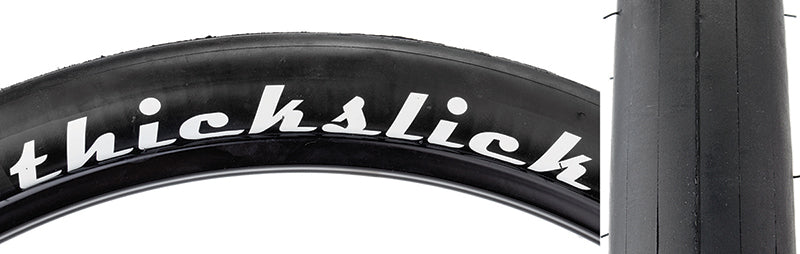 Close-up of the 27.5x1.95 ThickSlick Comp Bicycle Tire showcasing its thick, puncture-resistant tread with white text detailing. Ideal for fixie riders, offering durability and long wear life.