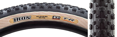 Close-up of the 27.5x2.2 Black/Tan Ikon EXO/TR Bicycle Tire showcasing its high-volume casing and fast-rolling tread design, offering excellent grip and durability for various riding conditions.