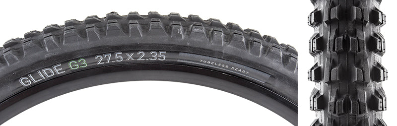 Close-up of a 27.5x2.35 Glide G3 Bicycle Tire, showcasing its aggressive stepped center and side lugs with deep siping designed for various trail types, emphasizing its tubeless-ready feature.