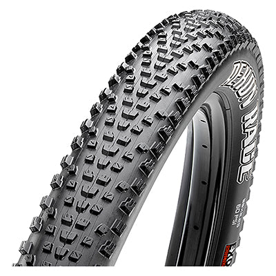 Close-up of a 27.5x2.35 Rekon Race EXO/TR Bicycle Tire showcasing its semi-slick tread design with smaller knobs and sidewall protection for puncture prevention.