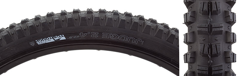 Close-up of a 27.5x2.4 Judge TCS Tough Fast Rolling Bicycle Tire, showcasing its large alternating center knobs and substantial shoulder knobs designed for traction in various conditions.