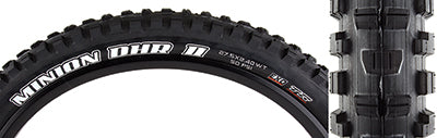 Close-up of the 27.5x2.4 Black/Black Minion DHR II EXO/TR/WT Bicycle Tire, showcasing its paddle-like center knobs and enhanced shoulder knobs for better grip and braking, designed for downhill biking.