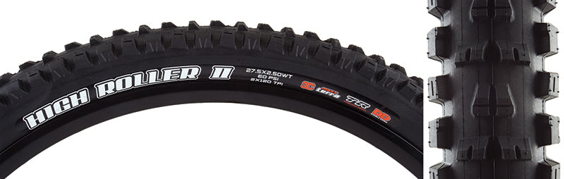 Close-up of a 27.5x2.5 High Roller II TERRA/DD/TR/WT Bicycle Tire, highlighting its mud-clearing tread design with ramped center knobs and aggressive shoulder knobs for enhanced traction on loose soil and corners.