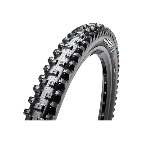 27.5x2.5 Shorty Bicycle Tire featuring large, aggressive knobs and spiked tread for ultimate traction, visible with close-up detailing of the side knobs designed for stable cornering and puncture-resistant sidewalls.