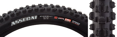 Close-up of a 27.5x2.5 Assegai EXO+/TR/WT Bicycle Tire showcasing its alternating vertical knobs, deep siping, and large corner knobs designed for improved traction and performance.