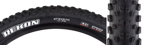 Close-up of the 27.5x2.6 Rekon DC/EXO/TR Bicycle Tire, showcasing its tread with well-spaced knobs and large siped corners, designed for diverse terrains and equipped with puncture-resistant sidewall protection.