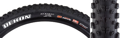 27.5x2.6 Rekon TERRA/EXO+/TR Bicycle Tire, featuring a tread with wide central knobs for control and L-shaped side knobs for support, close-up of the tire with visible white text and logo.