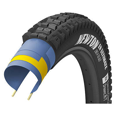 27.5x2.6 Newton Ultimate Bicycle Tire close-up showcasing its fast-rolling center tread and firmly supported side knobs, designed for superior traction and durability in various conditions.