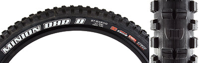 27.5x2.6 Minion DHR II TERRA/EXO+/TR/WT Bicycle Tire showing close-up of tread and sidewall with white text, highlighting aggressive lugs for maximum traction and durability.