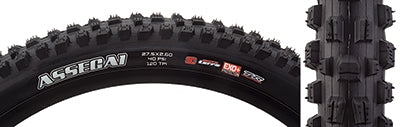 Close-up of the 27.5x2.6 Assegai EXO+/TR/WT Bicycle Tire, showcasing alternating vertical knobs with deep siping, horizontal knobs, and large corner knobs for enhanced traction in turns.