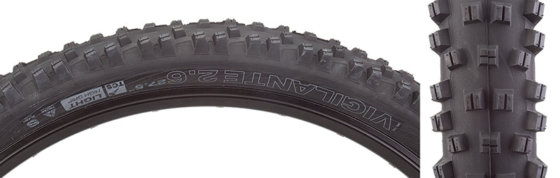 Close-up of the 27.5x2.6 Vigilante TCS Light High Grip Bicycle Tire showcasing its lugged open tread pattern and sturdy side knobs designed for optimal traction and stability on rough terrains.