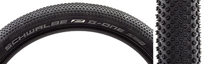 Close-up of a 27.5x2.8 G-One DD Allround Performance Bicycle Tire showcasing densely packed micro knobs and a dual compound casing designed for gravel use, featuring dual layer sidewall protection.