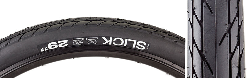 Close-up of the 29x2.2 Slick Comp Bicycle Tire, highlighting its tread designed to channel water away, robust casing, and wire beads for non-tubeless use.