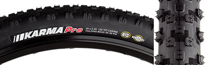 29x2.2 Karma Pro Bicycle Tire featuring small, square knobs and large air casing for comfort. Dual tread compound and tubeless-ready design visible, showcasing advanced tread pattern and robust sidewalls.