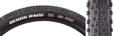 Close-up of the 29x2.25 Rekon Race EXO/TR Bicycle Tire showcasing its semi-slick tread design with smaller, shorter knobs and white sidewall text.