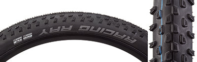 Close-up of a 29x2.25 Racing Ray Performance Twin Bicycle Tire showcasing directional tread with siping and large horizontal corner lugs, designed for enhanced cornering traction on modern XC trails.