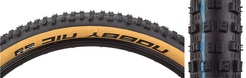 Close-up of a 29x2.25 Nobby Nic Evolution LiteSkin Bicycle Tire showcasing V-grooves and robust outer blocks designed for enhanced braking and cornering control, ideal for racing and trail riding.