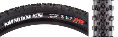 Close-up of a 29x2.3 Maxxis Minion SS DD/TR Bicycle Tire showcasing its low-profile, heavily ramped center patch with large side knobs, ideal for hardpack single track.