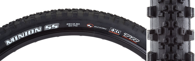 Close-up of a 29x2.3 Minion SS DC/EXO/TR/SW Bicycle Tire, showcasing the low-profile, heavily ramped center tread and large side knobs designed for hardpack single track, with EXO sidewall protection visible.