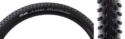 29x2.35 Racing Ray Bicycle Tire close-up, showcasing its directional tread with larger horizontal corner lugs for improved cornering traction, designed for front tires on modern XC trails.