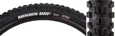 Close-up of the 29x2.5 Minion DHF DC/EXO/TR Bicycle Tire, highlighting the tread pattern with ramped and channel-cut knobs for grip, and EXO sidewall protection.