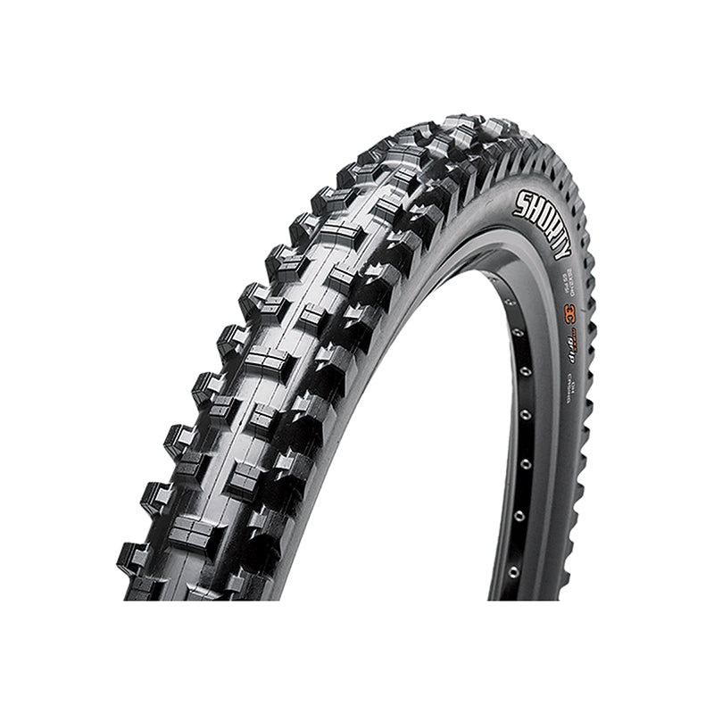 29x2.5 Shorty Bicycle Tire featuring large, aggressive knobs and spiked sidewalls for traction in loose soil. Close-up highlights EXO sidewall protection and Tubeless Ready design optimized for wide rims.