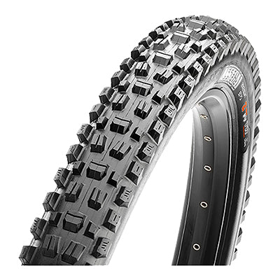 Close-up of the 29x2.5 Assegai EXO/TR/WT Bicycle Tire, showcasing the alternating vertical knobs, deep siping, and large corner knobs designed for enhanced traction and performance in downhill biking.