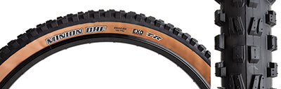 Close-up of the 29x2.6 Minion DHF EXO/TR/WT Bicycle Tire, showcasing its black tread with ramped knobs and channel-cut knobs for enhanced grip and control.