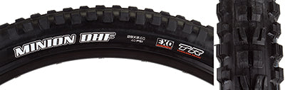 Close-up of a 29x2.6 Minion DHF WT/DC/EXO/TR Bicycle Tire, highlighting the tread with ramped knobs and channel-cut edges for control and precise cornering.