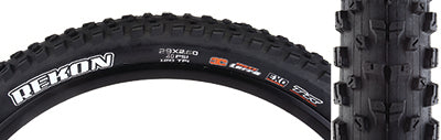 Close-up of a 29x2.6 Rekon TERRA/EXO/TR Bicycle Tire, highlighting wide knobs for control and L-shaped side knobs for support. The tire features tubeless-ready and sidewall protection for enhanced durability.