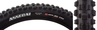 Close-up of the 29x2.6 Assegai 3CT/EXO/TR Bicycle Tire, showcasing its alternating vertical knobs, deep siping, and large corner knobs designed for improved traction and durability.