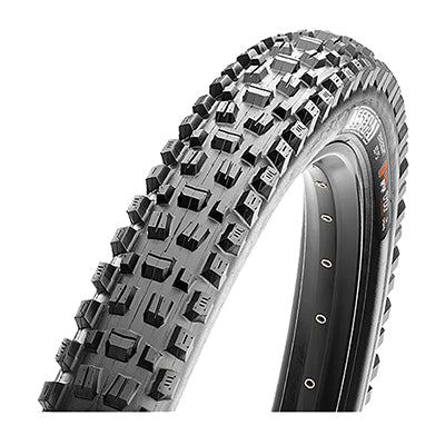 Close-up of the 29x2.6 Assegai DC/EXO/TR/WT Bicycle Tire showcasing alternating vertical knobs with deep siping, horizontal knobs, and large corner knobs for enhanced traction and puncture-resistant sidewall protection.