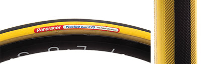 Close-up of the 700x22 Black/Yellow Practice Dual Bicycle Tire, showcasing its tread pattern and dual-compound design, ideal for training and racing, with a removable 42mm valve visible.