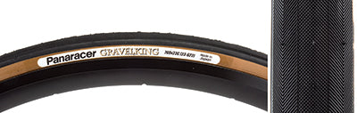 Close-up of the 700x23 Black/Brown Gravel King Slick Bicycle Tire, showcasing its minimalist tread and robust volume designed for versatile performance on both gravel and road surfaces.