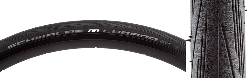 Close-up of the 700x23 Lugano Active Lite K-Guard Bicycle Tire, showcasing its detailed tread pattern designed for fast rolling and enhanced corner grip.