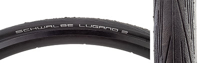 Close-up of the 700x23 Lugano II Active Lite K-Guard Bicycle Tire, showcasing its classic tread pattern and durable 50 epi carcass, highlighting the K-Guard belting and LiteSkin sidewalls.