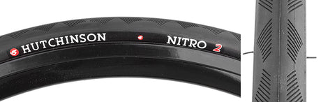 Close-up of the 700x25 Nitro 2 Bicycle Tire, showcasing its tread pattern and the white text on the black rubber, designed for all-weather performance on both wet and dry pavement.