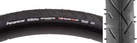 Close-up of the 700x25 Ribmo Fold Bicycle Tire, showcasing its detailed tread pattern and highlighting durability. The image emphasizes Protite puncture protection, ideal for urban commuting.